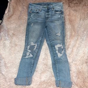 Shredded skinny blue jeans
